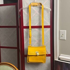 Miguel Kors small Leather Traveler Crossbody Bag.
